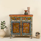 Image of a hand painted cabinet made of reclaimed wood with ornate floral design in vintage style.