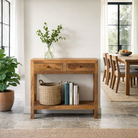 Lifestyle inspiration for a Ibiza style Mango wood console table with two drawers and bottom shelf, warm natural finish, 100 × 40 × 90 cm.