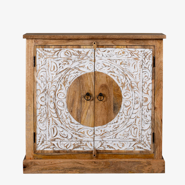 White background image of a carved wood furniture cabinet made from mango wood with floral whitewashed doors, 90 × 40 × 90 cm.