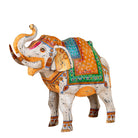 White background image of a handcrafted metal elephant sculpture with painted finish – a unique painted metal decoration perfect for vintage home decor and artistic interiors.