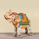 Image of a handcrafted metal elephant sculpture with painted finish – a unique painted metal decoration perfect for vintage home decor and artistic interiors.