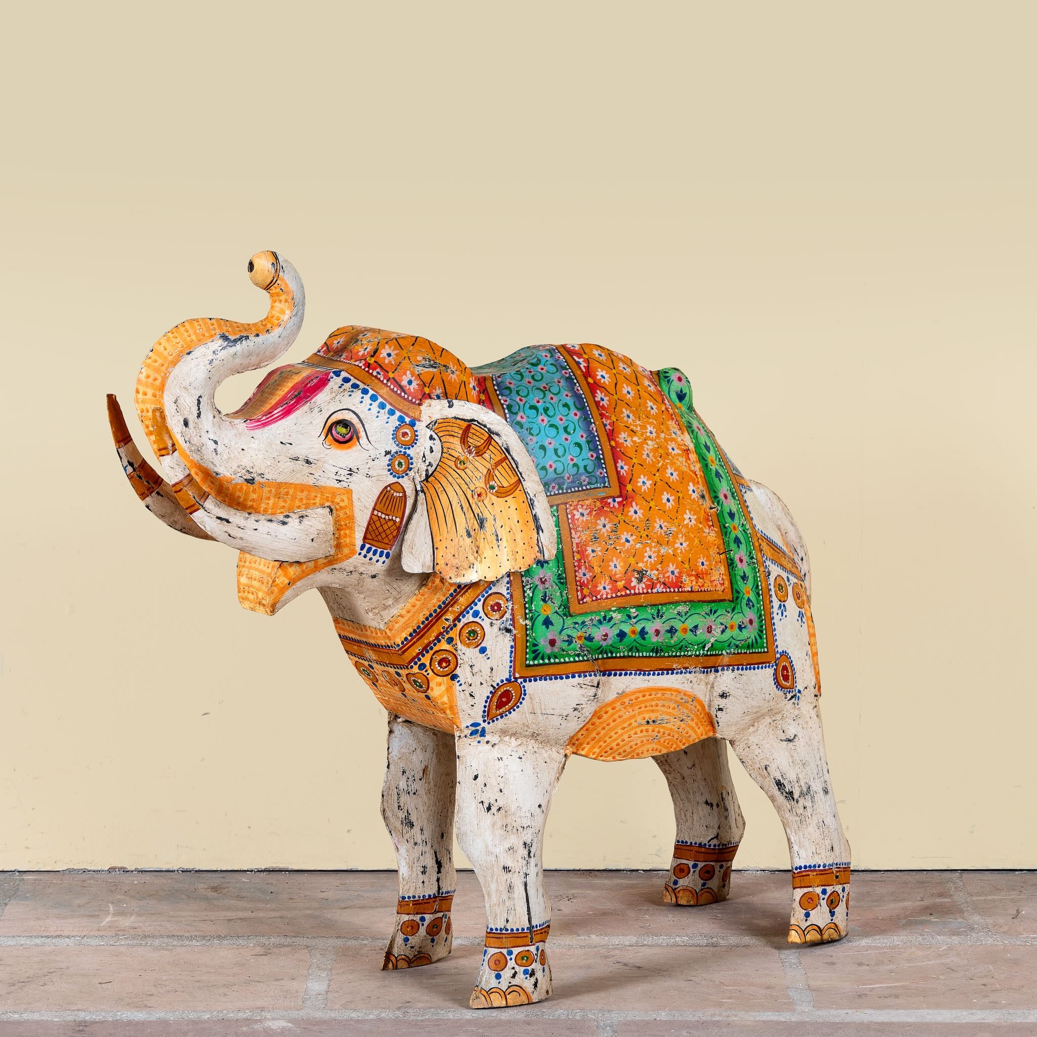 Image of a handcrafted metal elephant sculpture with painted finish – a unique painted metal decoration perfect for vintage home decor and artistic interiors.
