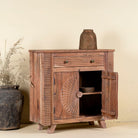 Open Door image of a acacia wood cabinet with hand-carved sunburst doors, grooved details, and one drawer, 90 × 40 × 90 cm.