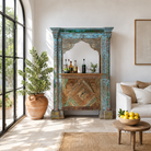 Lifestyle image of a vintage bar made of reclaimed antique teak wood with hand-carved detailing, unique wooden furniture with storage, 160 × 60 × 213 cm.