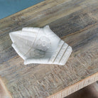 White marble decorative bowl shaped like cupped hands with floral carving – hand-carved Indian marble accessory.