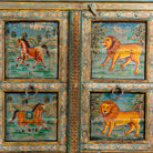 Close up image of a Pavan hand-painted reclaimed wood sideboard with original Indian teak doors and colourful tiger, camel, elephant, horse and lion motifs 193cm