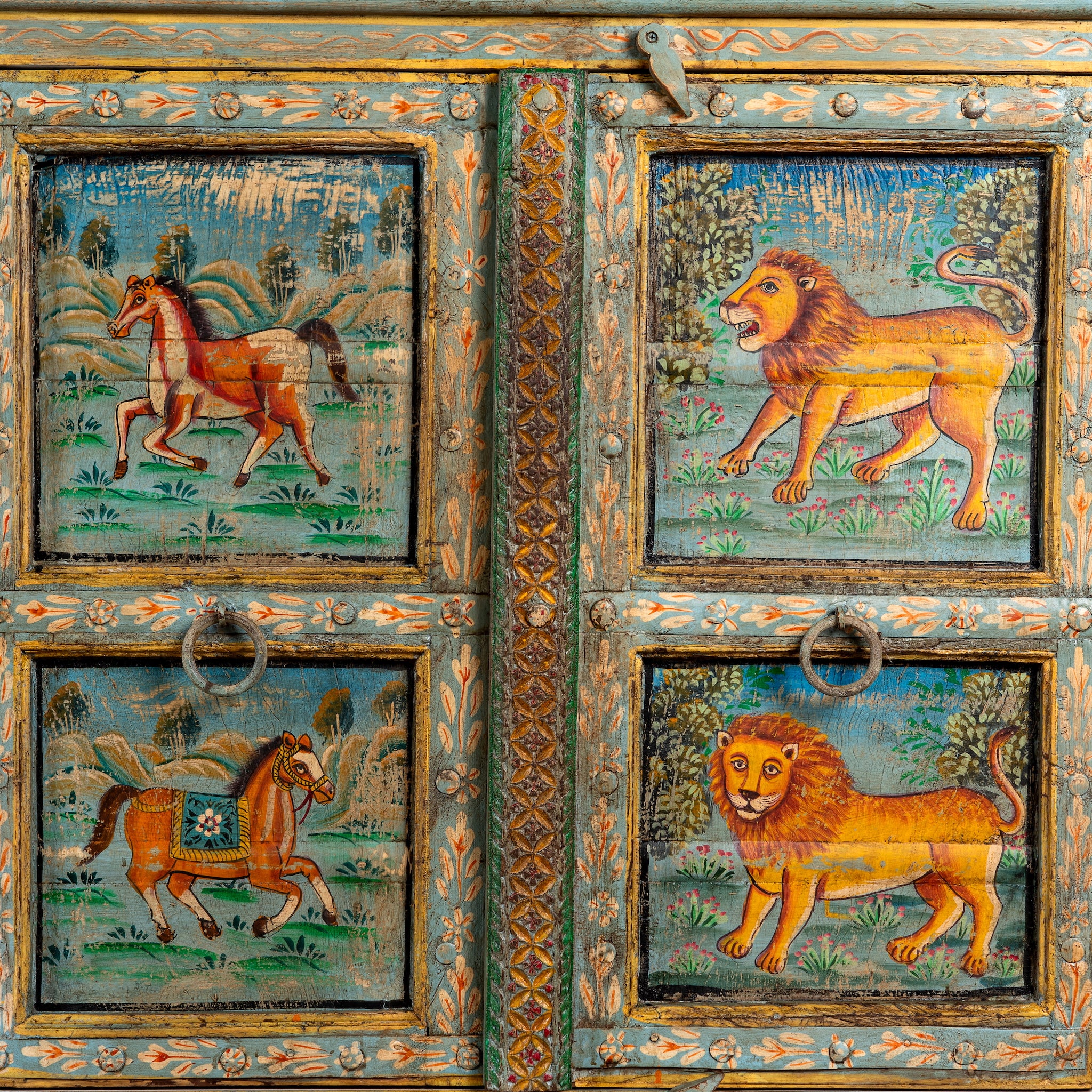 Close up image of a Pavan hand-painted reclaimed wood sideboard with original Indian teak doors and colourful tiger, camel, elephant, horse and lion motifs 193cm