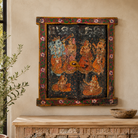 Lifestyle image of a Dancing Ganesh antique reclaimed wood mirror with hand-painted Indian artwork on an authentic vintage reclaimed wooden mirror frame, 50x50x5cm.