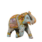 Decorative elephant figurine with colorful patterns on a white background