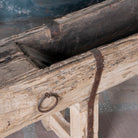 Cose up image of a Hanshi antique Indian reclaimed teak wood bench crafted from a historic feeding trough, 234cm