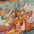 Close up image of a Hanuman antique reclaimed wood mirror with hand-painted Hindu artwork, authentic Indian vintage wooden mirror frame, 50x50x5cm.