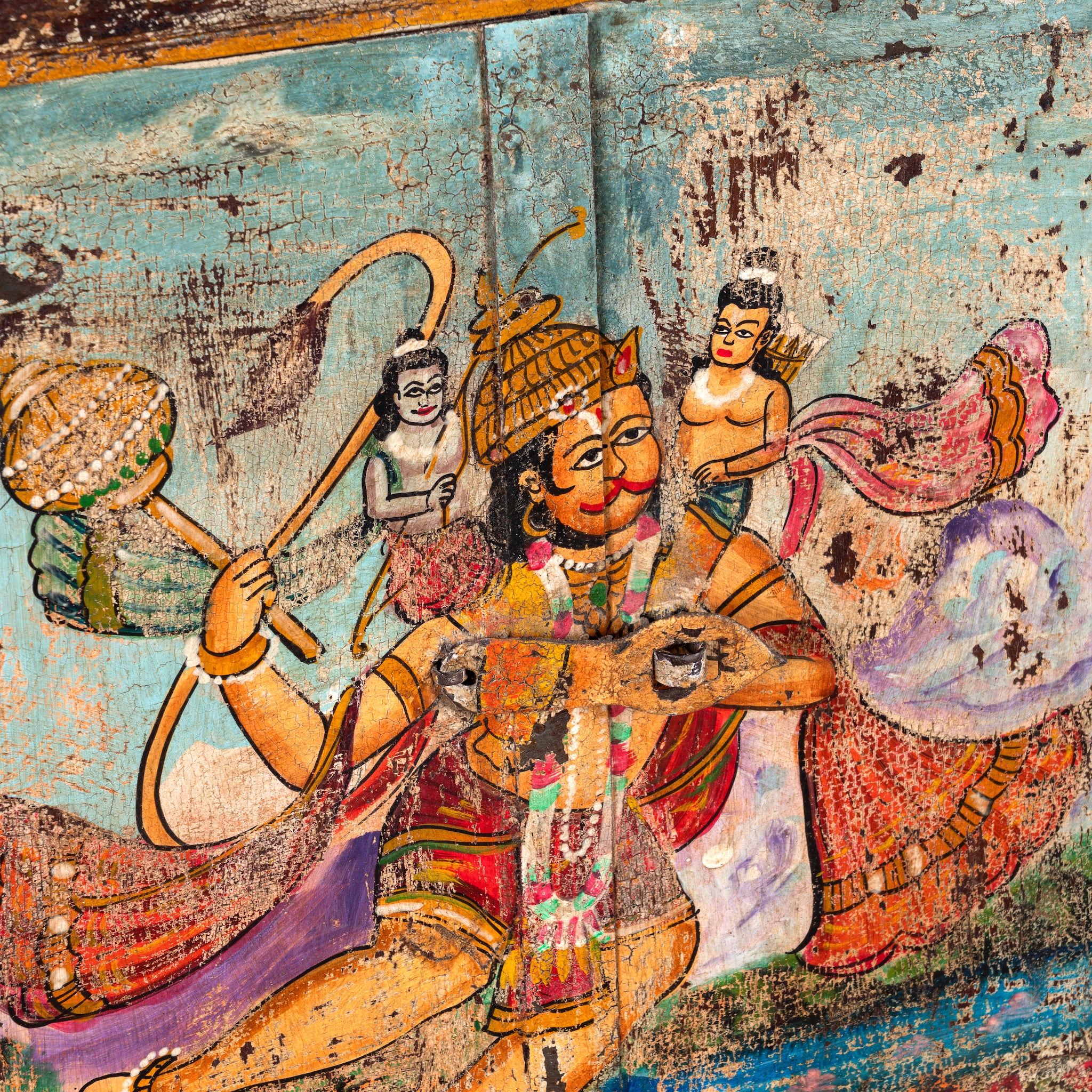 Close up image of a Hanuman antique reclaimed wood mirror with hand-painted Hindu artwork, authentic Indian vintage wooden mirror frame, 50x50x5cm.