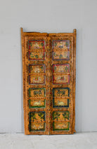 Indian painted door decoration featuring mythological and village scenes on reclaimed teak—an artisanal Indian door panel with folk motifs and vintage patina.