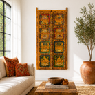 Lifestyle image of a Indian painted door decoration featuring mythological and village scenes on reclaimed teak—an artisanal Indian door panel with folk motifs and vintage patina.