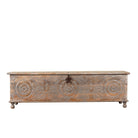 White background image of a Harivansh hand carved mango wood chest with floral design and distressed vintage finish 180cm