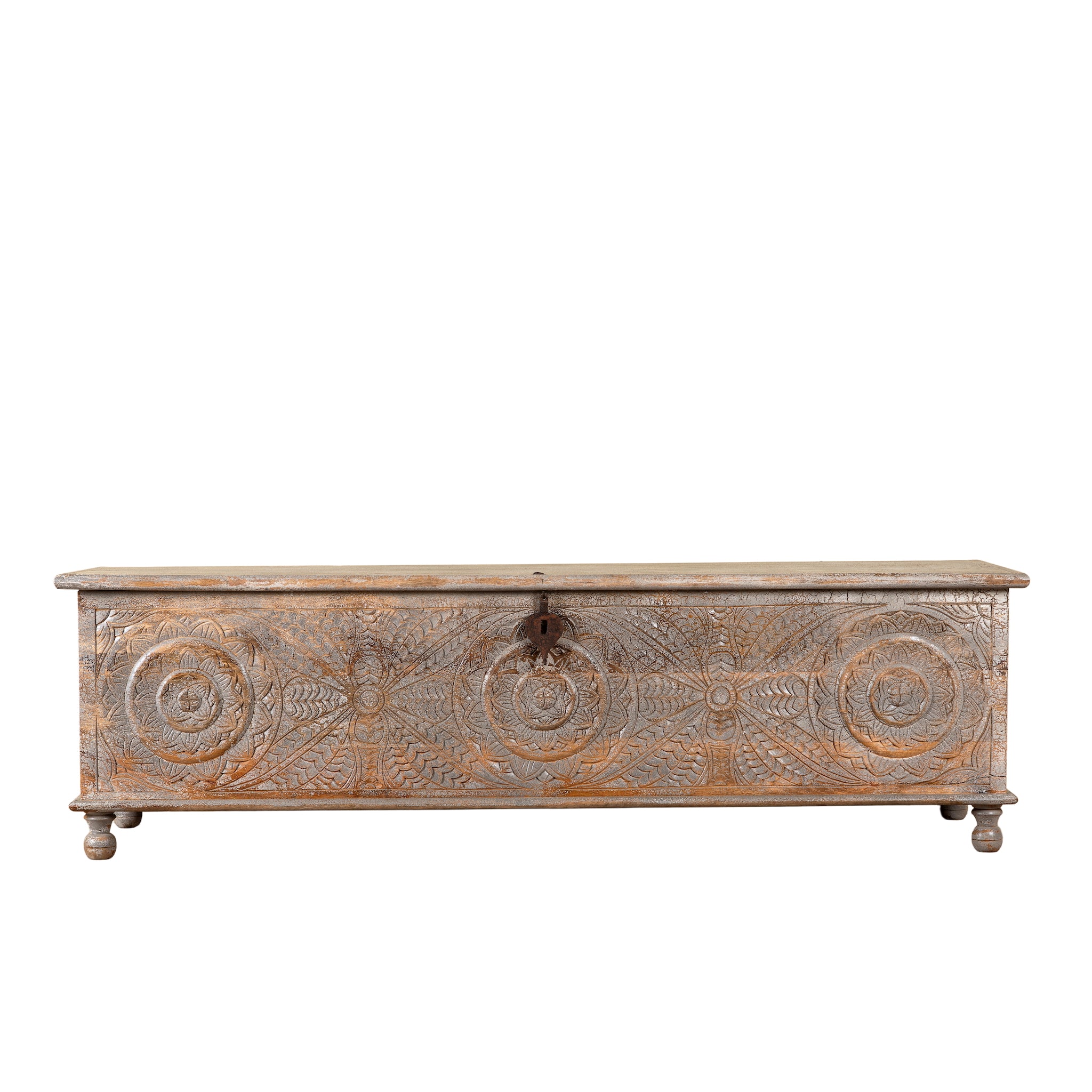 White background image of a Harivansh hand carved mango wood chest with floral design and distressed vintage finish 180cm