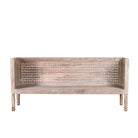 White background image of a hand-carved reclaimed wood bench with geometric backrest design, sandblasted Ibiza style finish, ideal for boho chic living room interiors, 176×56×95 cm.