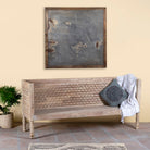 Side angle image of a hand-carved reclaimed wood bench with geometric backrest design, sandblasted Ibiza style finish, ideal for boho chic living room interiors, 176×56×95 cm.
