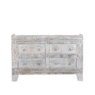 White background image of a handcrafted chest of drawers Hemali made from reclaimed wood, featuring four carved drawers with circular motifs and a whitewashed finish. A rustic, sustainable furniture piece with soft texture and elegant detailing.