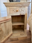 Open door image of a pair of hand-carved nightstands made of sandblasted mango wood with floral Mediterranean patterns and one drawer – Hriday bedside tables by Om Home & Garden