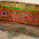Close up image of a hand-painted reclaimed wood chair-style horse bench with double carvings; unique furniture for a bohemian interior, 160 × 70 × 90 cm.