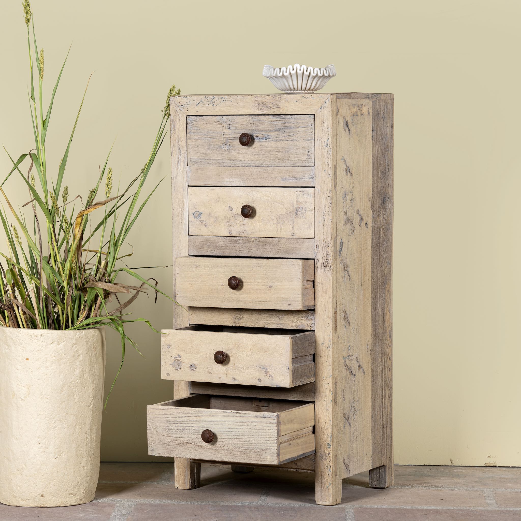 Open drawer image of a chest of 5 drawers made from reclaimed wood with rustic finish; Ibiza style sustainable furniture, 50 × 35 × 110 cm.