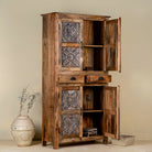 Open door picture of a hand-carved mango wood cabinet with floral motifs and silver finish – bedroom furniture with rustic charm and artisanal detail.