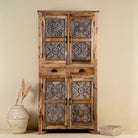Hand-carved mango wood cabinet with floral motifs and silver finish – bedroom furniture with rustic charm and artisanal detail.