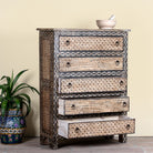 Side angle image with open drawers of a hand painted beige-black wooden chest of 5 drawers in vintage style.