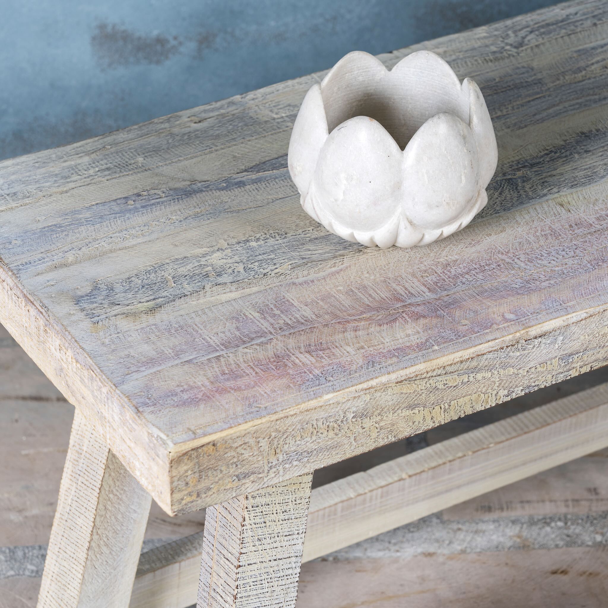 White ceramic bowl Ishika on a wooden table with a blurred background