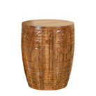 White background image of a hand-carved mango wood coffee table with barrel shape and warm rustic finish; vintage style coffee table, 45 cm diameter, 55 cm height.