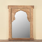 Ishvank reclaimed teak wood mirror made from an old Indian window frame with carved details and arched opening, 87x115cm
