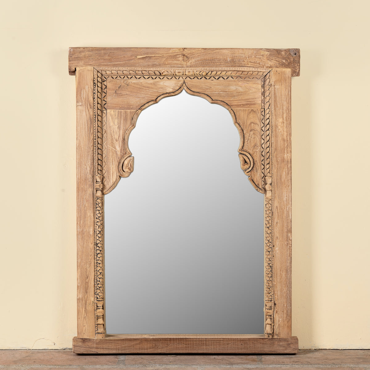Ishvank reclaimed teak wood mirror made from an old Indian window frame with carved details and arched opening, 87x115cm