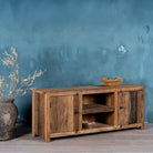 Side view image of a driftwood lowboard made from reclaimed wood with two cabinets, open shelving, and rustic minimalist design, 150 × 40 × 60 cm.