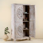 Open door image of a white washed armoire with hand-carved Tree of Life motif, mango wood carved wood furniture with storage, 90 × 40 × 180 cm.