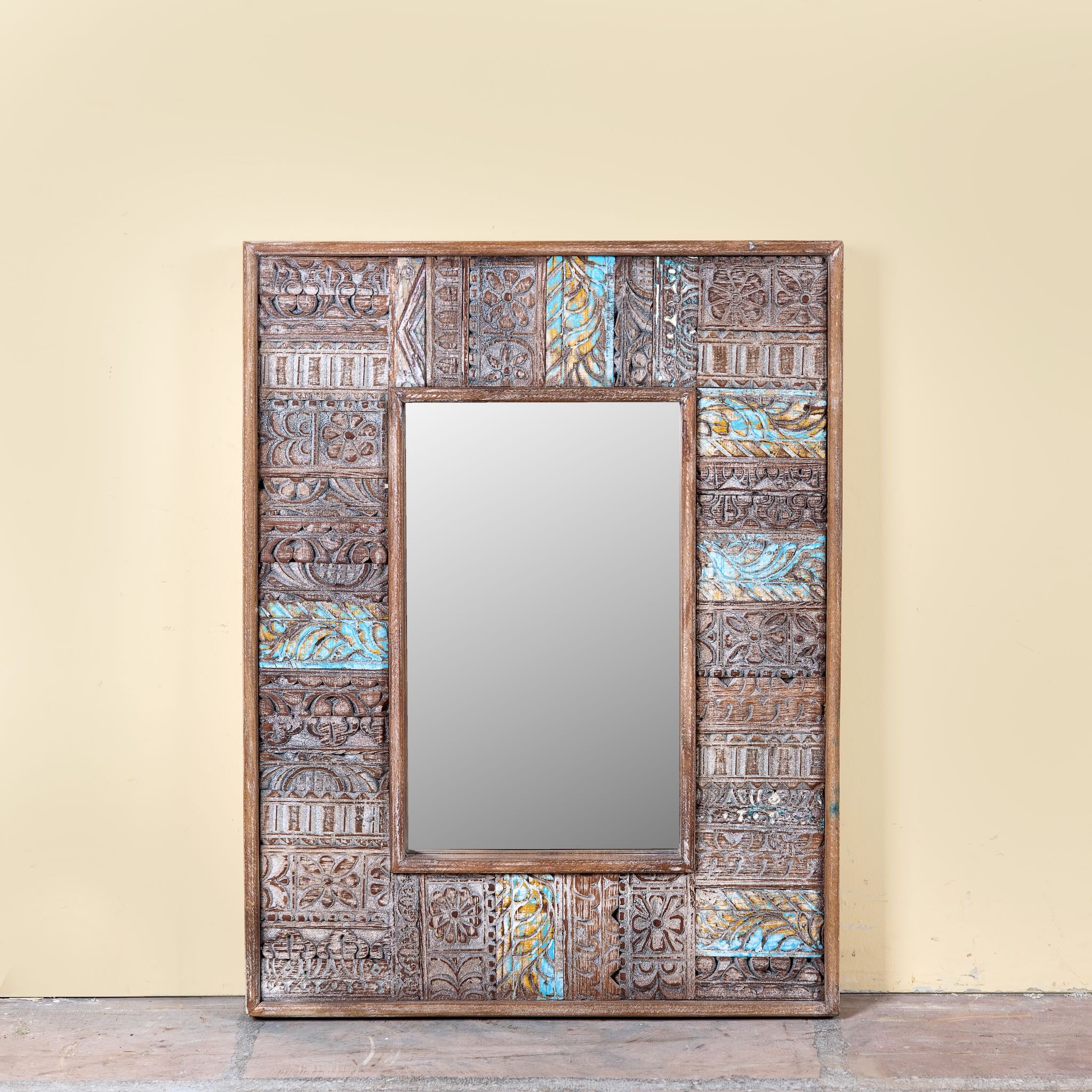 Rectangular mango wood mirror with reclaimed wood patchwork frame and distressed finish; perfect for vintage home decor and bohemian styling, 64 × 5 × 84 cm.