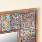 Close up image of a rectangular mango wood mirror with reclaimed wood patchwork frame and distressed finish; perfect for vintage home decor and bohemian styling, 64 × 5 × 84 cm.