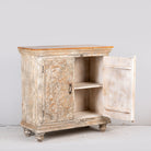 Image showing open door of a square carved wood sideboard with whitewashed floral detailing; ideal as living room furniture, 90 × 90 × 40 cm.