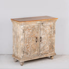 Side angle image of a square carved wood sideboard with whitewashed floral detailing; ideal as living room furniture, 90 × 90 × 40 cm.