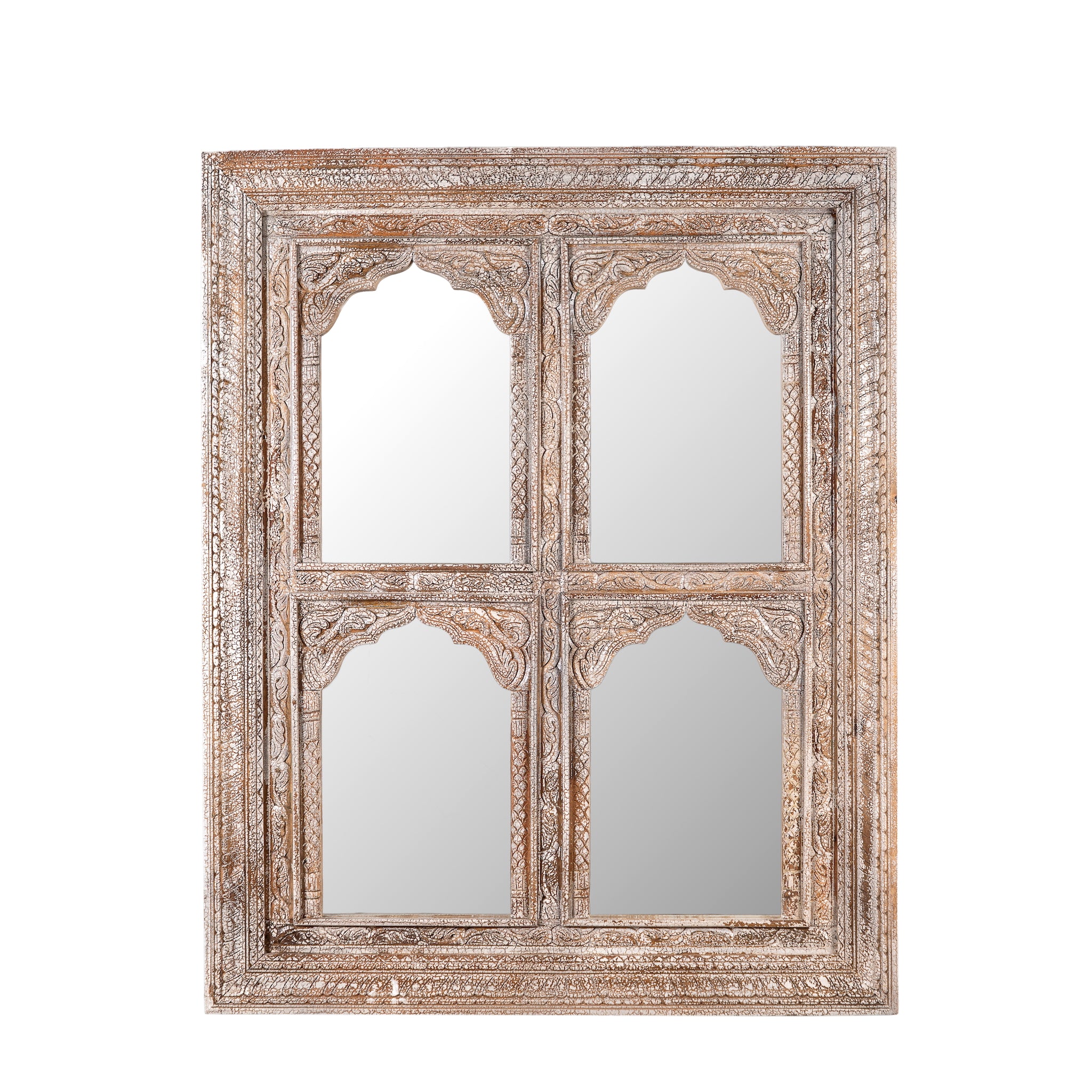 White background image of a hand-carved wall mirror Jamnagar made from solid mango wood with floral design. A bold piece of Indian furniture online blending craftsmanship and natural beauty.