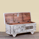 Image showing open lid of a Janash whitewashed mango wood coffee table chest with decorative iron fittings and wooden wheels 116cm