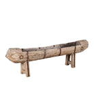 White background image of an antique console table repurposed from reclaimed teak wood feeding trough with carved details and iron fittings; unique furniture ideal for rustic interiors, compatible with teak wood benches, 234 × 31 × 61 cm.