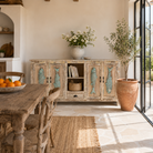 Lifestyle image of a Jhund hand carved mango wood sideboard with blue fish motif doors 184cm