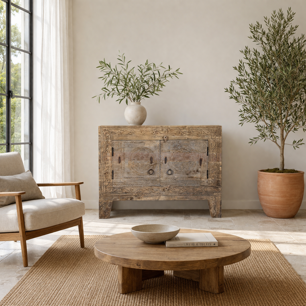 Lifestyle image of a reclaimed wood sideboard made from antique teak doors with carved detailing; teak furniture, 110 × 45 × 83 cm.