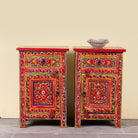 Joven pair of hand painted reclaimed wood nightstands with one drawer, one cabinet door, floral artwork, and vibrant red boho style finish.