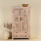 Hand-carved mango wood cabinet with floral and geometric detailing – carved wooden furniture and elegant bedroom storage by Om Home & Garden.