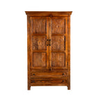 White background image of a dark brown mango wood cabinet with hand carvings, 2 drawers and ample storage.
