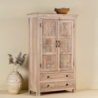 Side view of a hand-carved mango wood cabinet with floral and geometric detailing – carved wooden furniture and elegant bedroom storage by Om Home & Garden.