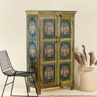 Side angle image of a hand painted wardrobe made of reclaimed wood with floral motifs; unique furniture for bedrooms or living rooms, 90 × 45 × 150 cm.
