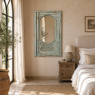Lifestyle image of a Kaichur blue washed hand carved mango wood wall mirror, 160cm